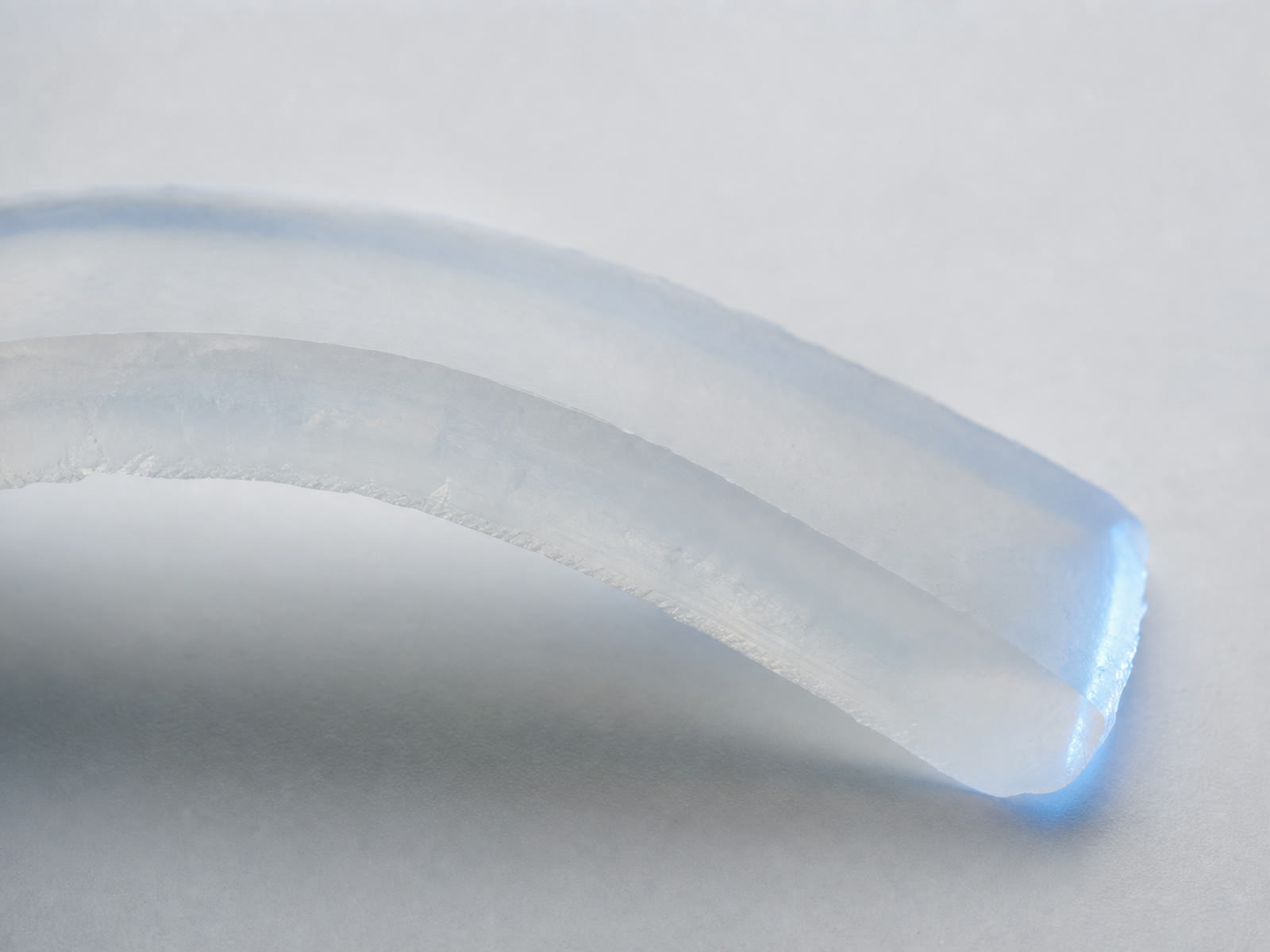 Concept view of a translucent silicone elastomer section, not a measured micrograph
